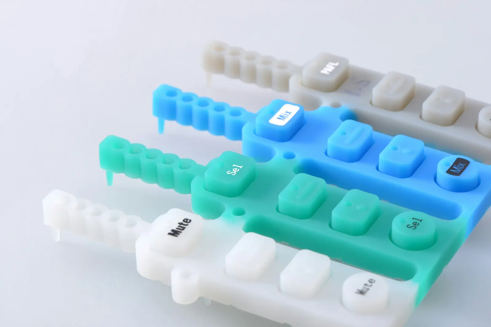 Flexible plastic molded components with soft-touch or bendable features